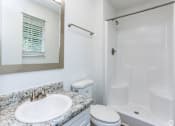 Thumbnail 4 of 20 - a bathroom with a sink toilet and a shower